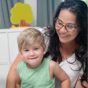 "Outsmarting poverty" with LEO - a parent and child sharing a happy moment. Parent is looking at child and child is looking at the camera.